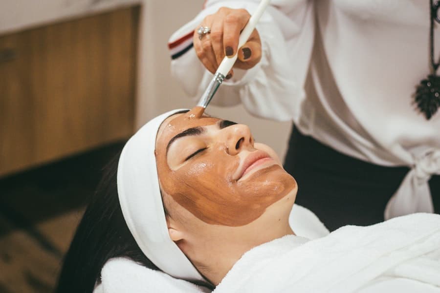 Esthetician applying a facial mask